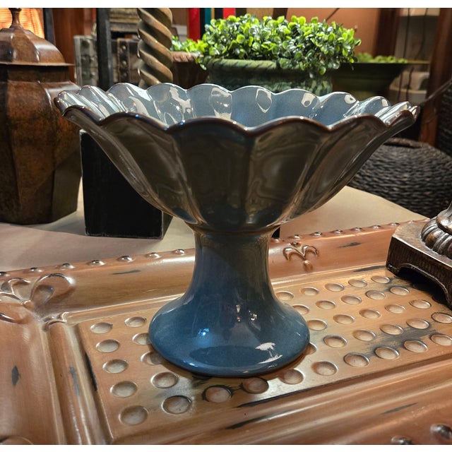 Pretty Blue Pedestal Vase with Brown Accents around the top edges. This is perfect as a stand alone piece. 6.5 inches tall...