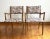 A pair of Drexel Profile dining chairs by John Van Koert. The vintage side chairs have been reupholstered in a flame...