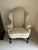 This Queen Anne style wingback chair is a timeless statement piece, crafted from rich mahogany and designed with graceful,...