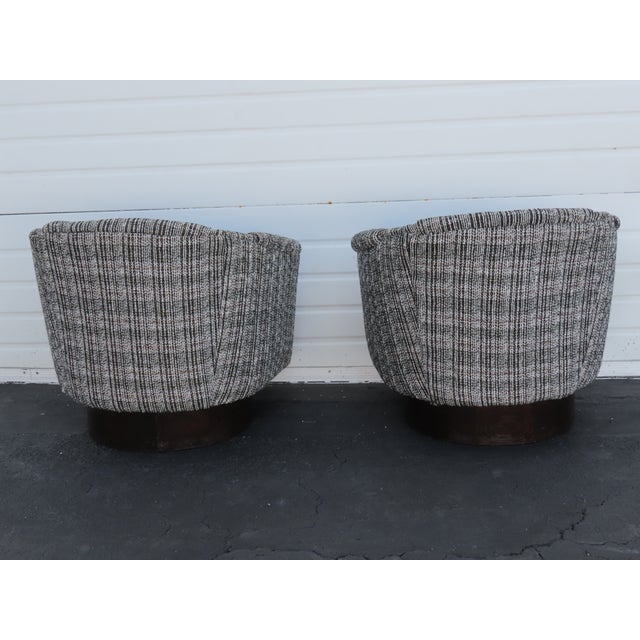 This Pair of Side Chairs are made of wood, and fabric. The Chairs was labeled Carsons, and they have Milo Baughman style...