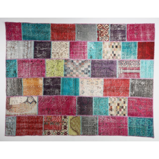 This beautiful vintage patchwork rug is a one of a kind handmade piece, created from carefully selected fragments of mid...