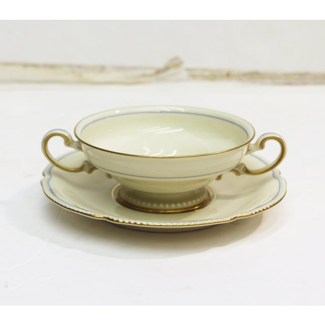 Set of eight cream soup bowls & saucers, Rosenthal Empire Blue Wreath. Ivory ground with pearl edges & hand gilding. Circa...