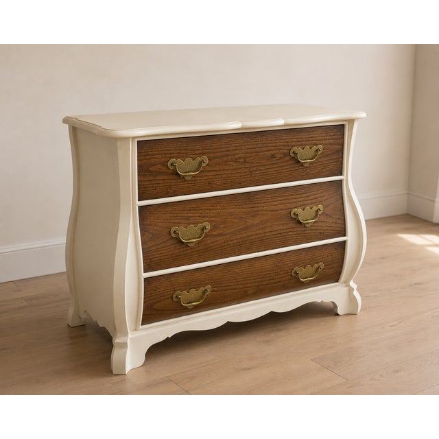 Description A beautifully refinished vintage French Provincial dresser featuring a warm sculpted cream finish paired with...