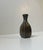 A rare bottle-shaped metal vase with unusual ornamental relief panels. Designed and made by just andersen in denmark circa...