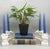 Elegant pair of Italian porcelain candle holders featuring sculptural rose blooms and layered florals cascading across a...