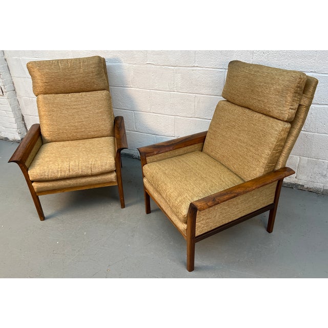 Make a refined statement with this pair of mid-century modern teak high-back armchairs, expertly designed to combine...