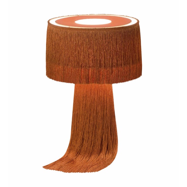 Draped with luxurious tassels, the Atolla collection will add warm lighting and textural elements to your space. Available...