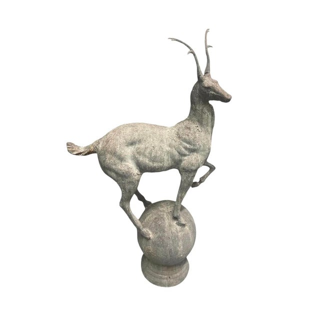 A captivating and rare pair of grand-scale, neoclassical-style cast iron garden sculptures depicting elegant gazelles (or...