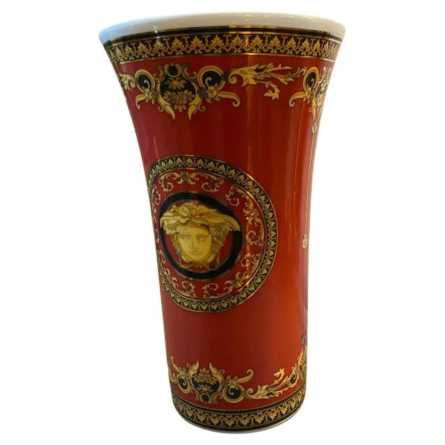 A red and gold porcelain vase designed by Gianni Versace and manufactured by Rosenthal in the Nineties. It's in perfect...