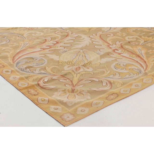 A stunning example of 19th-century French craftsmanship, this Antique Aubusson rug from circa 1880 epitomizes the opulence...