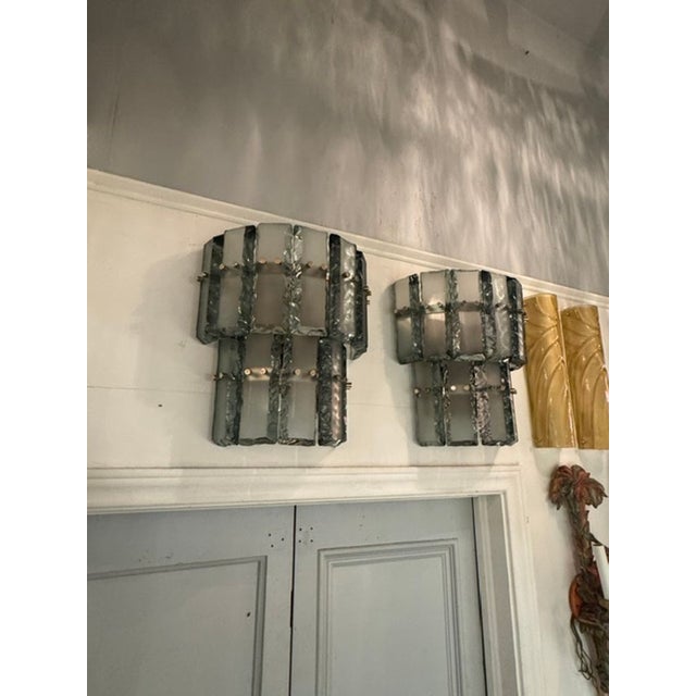 Pair of modern Green and Frosted Murano glass "ice block" sconces. with brass details. Elevate your space with the...