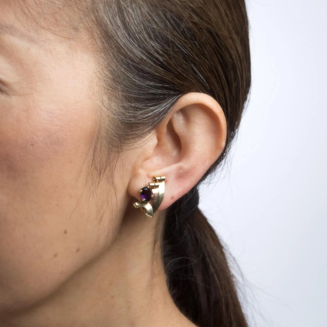 This is part of Chairish’s Fine Jewelry assortment. Elegant pair of retro vintage amethyst earrings (circa 1940s) crafted...