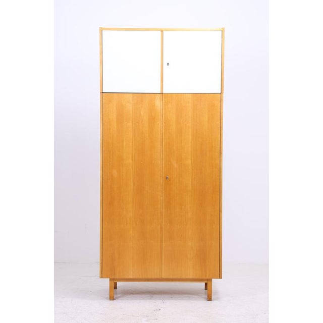Vintage wardrobe and linen cabinet from Deutsche Werkstätten Hellerau, dating from 1964. The clear design, the light birch...