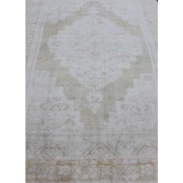 Medallion Design Vintage Oushak Rug in Muted Tones of Faded Yellow and Neutrals For Sale - Image 10 of 12