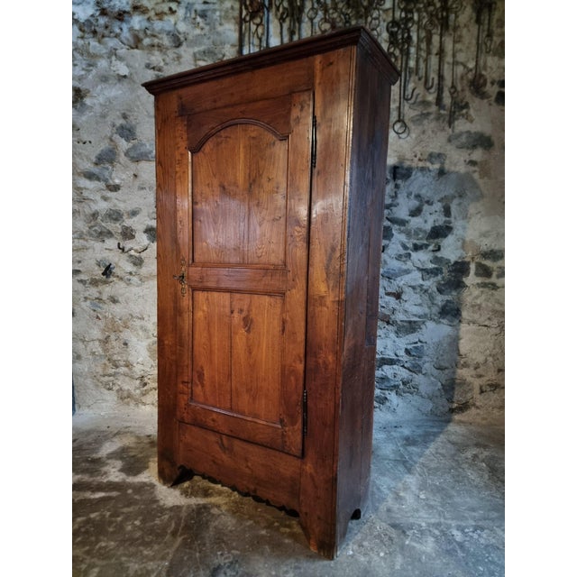 Antique French cabinet dating from the 18th century, traditionally known as a bonnetière. Constructed from solid chestnut...