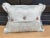 A pillow made from a circa 1880’s hand quilted French bedspread backed and edged with hand dyed linen damask. A down...