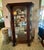 Antique Victorian Curved Glass China Cabinet. This piece features a prominent bow front glass door flanked by curved glass...