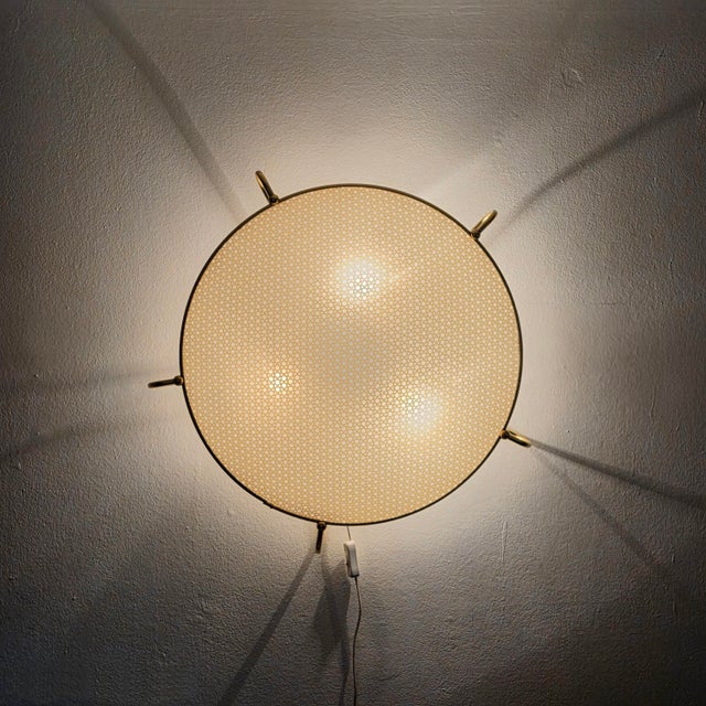 A very beautiful and elegant ceiling or wall light by erco leuchten, model no. 70. made in germany in the 1950s. The frame...