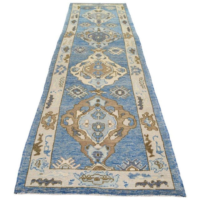 Hand-knotted with care using traditional rug-making techniques, this wool rug blends timeless craftsmanship with a modern...