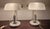 Two identical lamps. White marble and brass bases. Excellent condition. White glass shades. Also in very good condition (a...