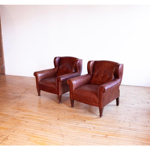 Lovely pair of vintage 1990s Ralph Lauren club chairs. Wonderful scale and form. Brown leather is rich in appearance. Rich...