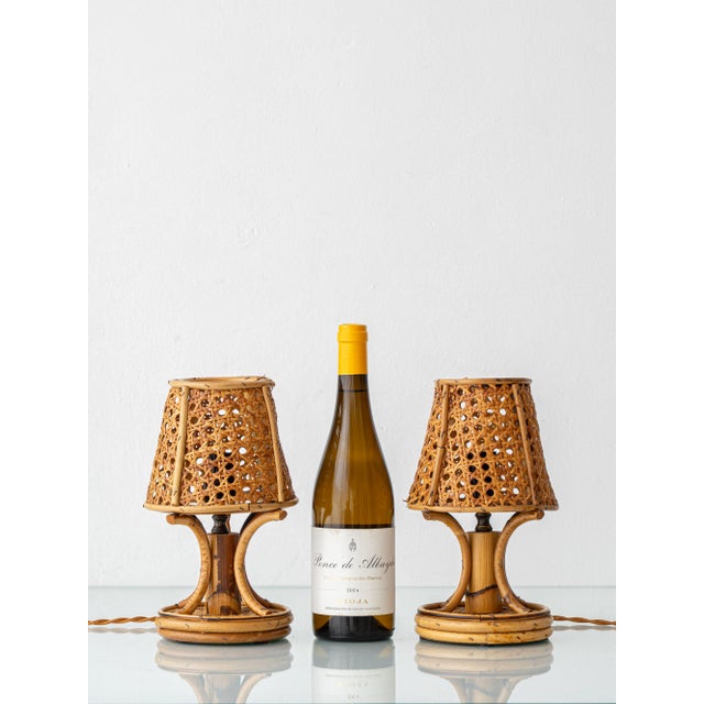 Small enough for a nightstand and woven entirely from natural materials, this pair of bamboo-and-rattan lamps is pure mid-...