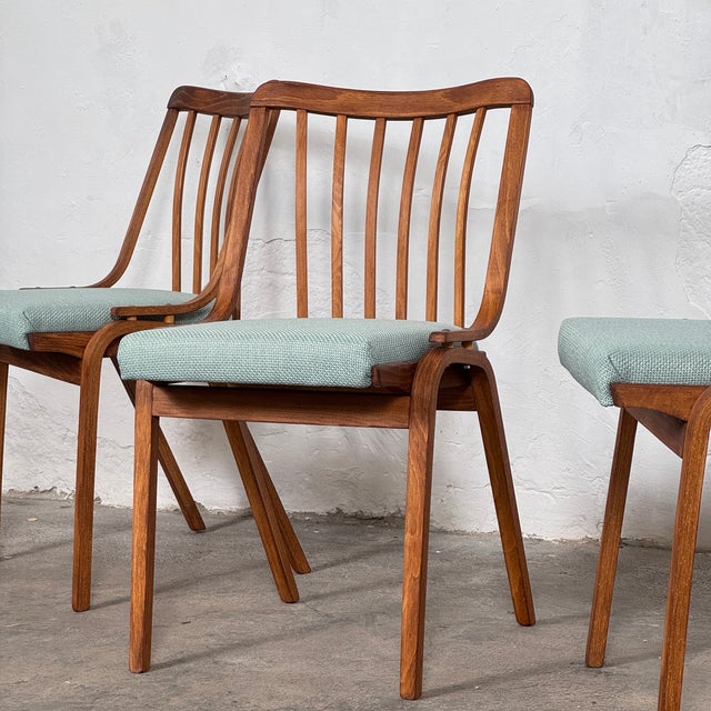 This set of four dining chairs is a classic example of mid-century modern czechoslovakian design. Designed by ludvík volák...