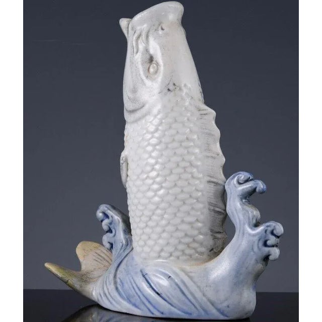 Hirado Blue and White Leaping Carp, Japanese, circa 19th Century A well-modeled porcelain carp is depicted leaping up...