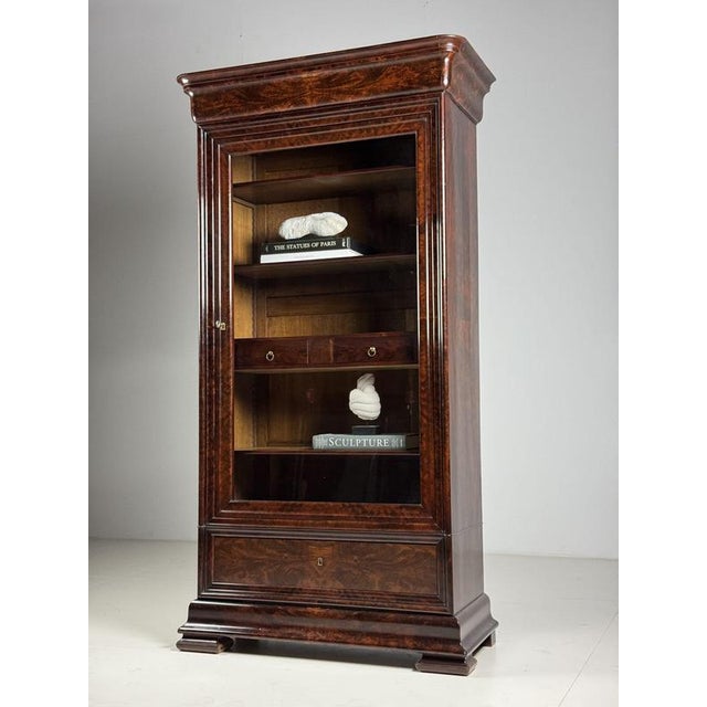 Biedermeier display cabinet/bookcase. In exceptionally good condition. Fully veneered with mahogany. On an oak base....