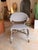 This woven resin wicker dining chair blends coastal, transitional, and organic-modern style with natural materials and...