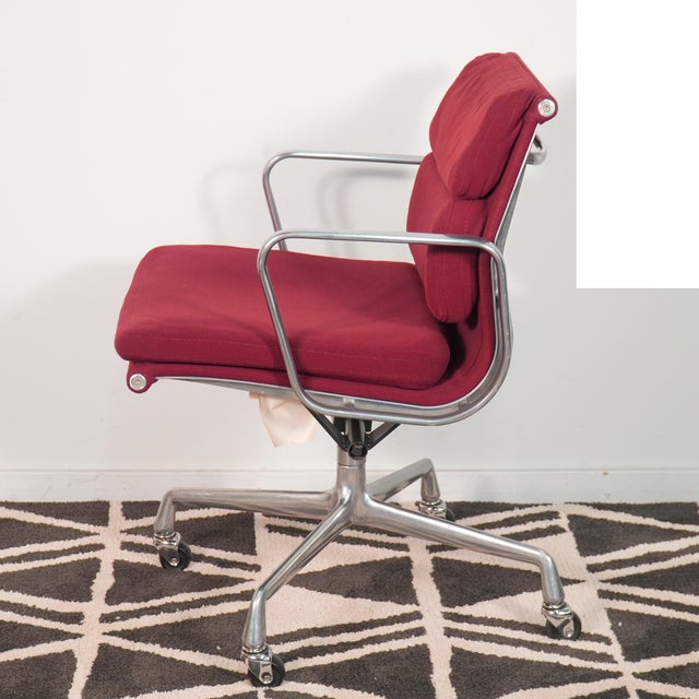 Ray and Charles Eames designed Herman Miller soft pad adjustable executive armchair in soft maroon velveteen fabric. It is...