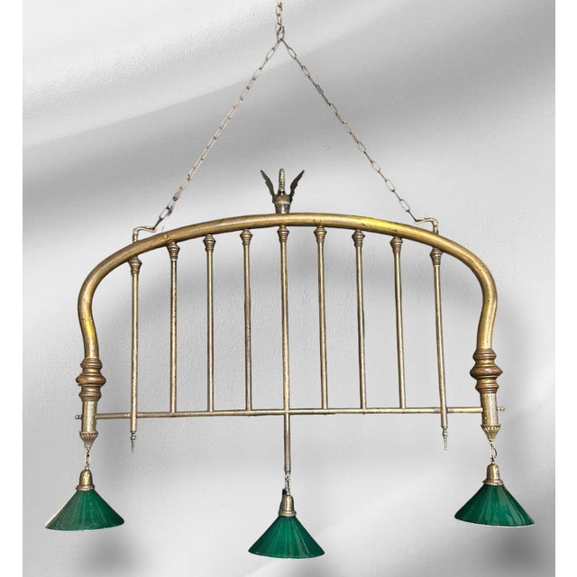 This simple but bold chandelier is a charming repurposing of antique American household items! This solid brass bedframe...