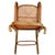Turn of the century Vienna Secession bent oak No. 4 rocking chair by Thonet features an elegant, sculptural frame crafted...
