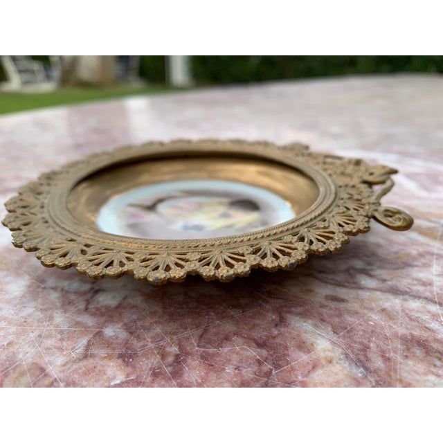 Here we have a beautiful miniature dog portrait in a gilt filigree metal frame. This adorable terrier looks like a long...