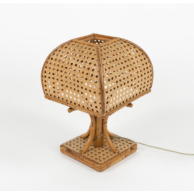 Midcentury beautiful hand-crafted table lamp in bamboo, rattan and wicker attributed to Louis Sognot. Made in Italy in the...