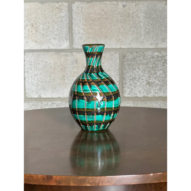 A unique vase designed by Stig Lindberg circa 1950s. Features a wonderful form with bulbous body tapering into a smaller...