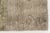 This is a vintage Turkish Oushak rug from the Mid 20th Century. The piece was hand-knotted.
