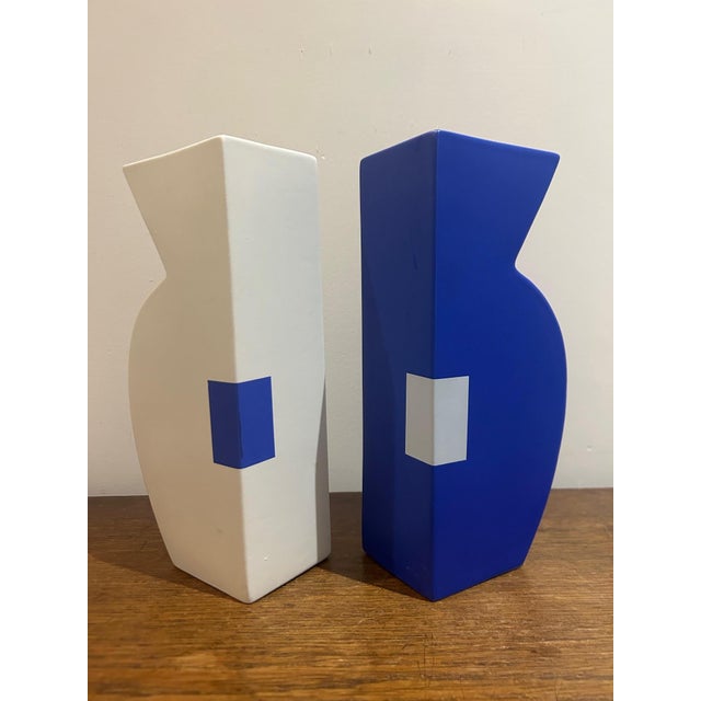 Pair of ceramic vases from the 1980s, featuring a graphic and contemporary design. These two pieces showcase complementary...