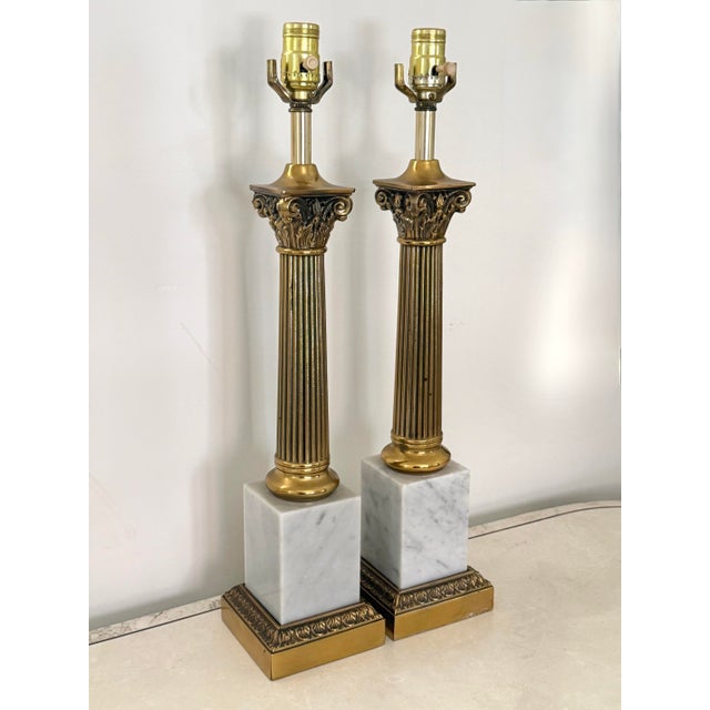 Midcentury pair of tall Italian white marble and brass neoclassical column table lamps. Please see condition details...