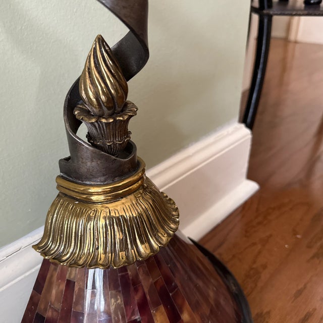 Spiral twisted Iron and Antiqued Brass Wall Sconce with Young Penshell Shade. 1 candelabra socket. Maitland Smith. Century...