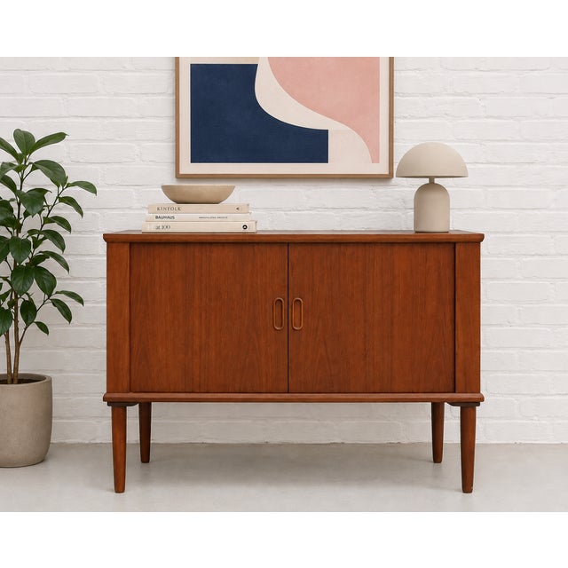 Danish Mid Century Modern Teak Tambour Door Jr. Credenza / Vinyl Storage Cabinet, c. 1960's. This beauty features perfect...