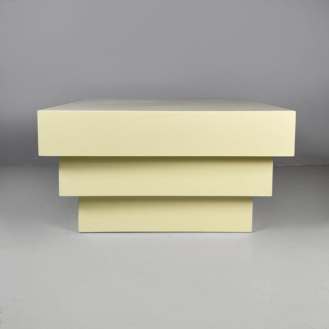Italian modern coffe table or pedestal in light yellow wood, 1980s Pedestal or coffee table with a square top, made...