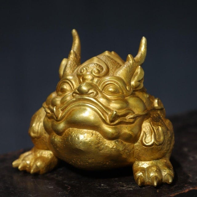 This charming sculpture depicts a toad, known as Jin Chan, a traditional symbol of wealth and prosperity. The figure is...
