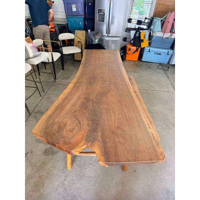 Stunning live edge dining table. Solid wood with beautiful natural grain. It has a unique, irregular shape. Super sturdy,...