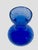 The is a vintage cobalt blue glass hyacinth forcing vase. This specific hourglass-like shape-featuring a wide bulbous...