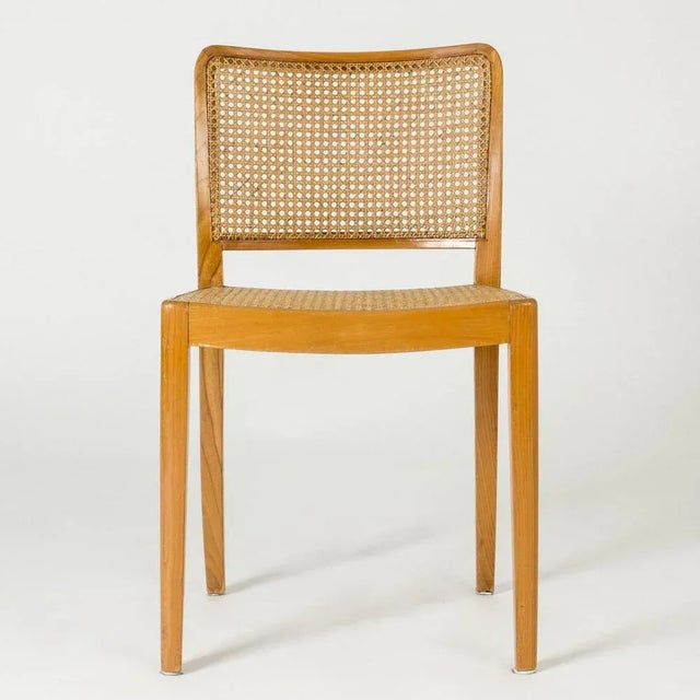 Lovely side chairs by Margareta Köhler, made from lacquered elm, with rounded forms. Rattan backs and seats. Three chairs...