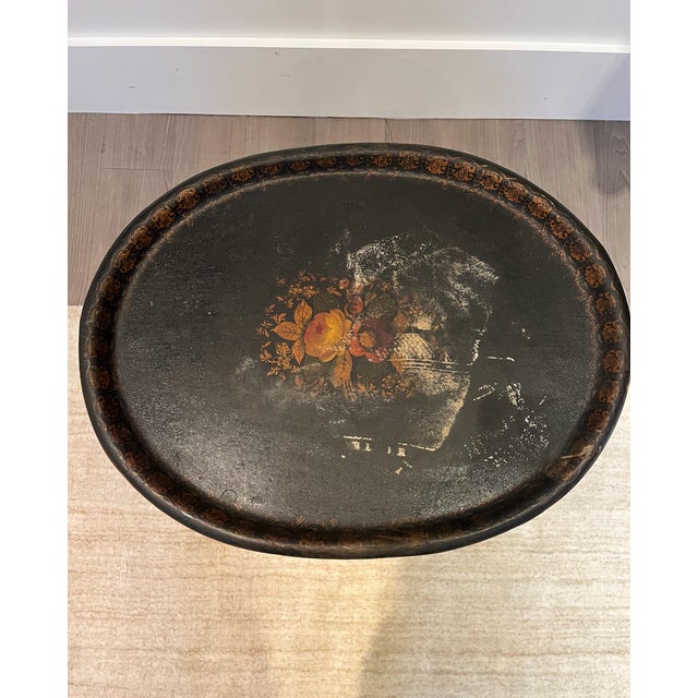 Place this elegant antique tole tray table next to your sofa or armchairs. Crafted in the 19th century, oval in shape, the...