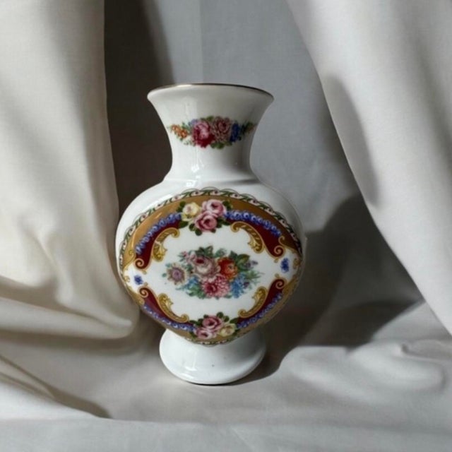 The maker mark on the bottom of the vase reveals that it is a vintage porcelain piece produced by the Italian design firm...