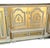 A spectacular vintage Rococo Revival display cabinet featuring an elaborate architectural silhouette, curved glass side...