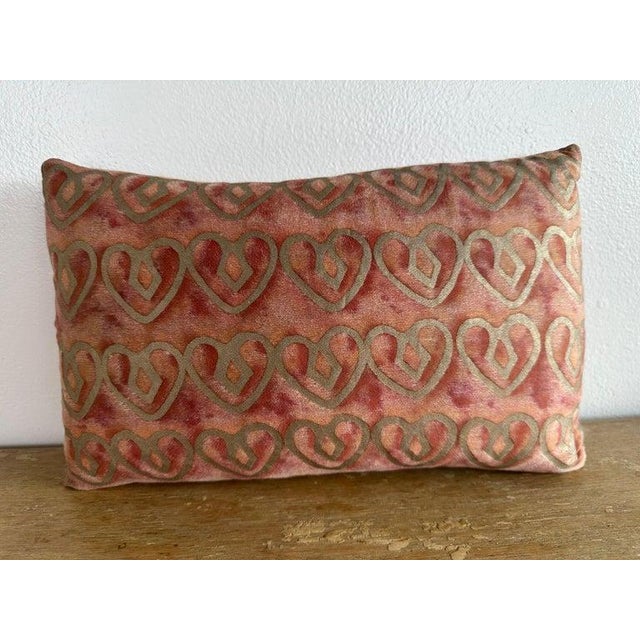 Authentic Fortuny textile pillow featuring a hand-printed velvet front with a rhythmic heart-like motif rendered in softly...